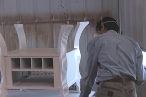 applying protective lacquer to a painted table base