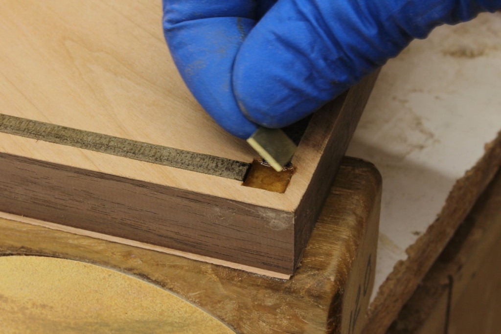 brass square fitted into pocket