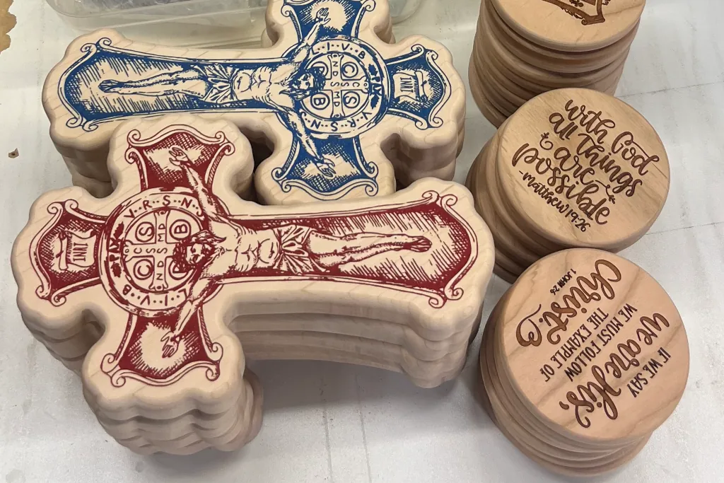 wooden crosses and coasters with engraving