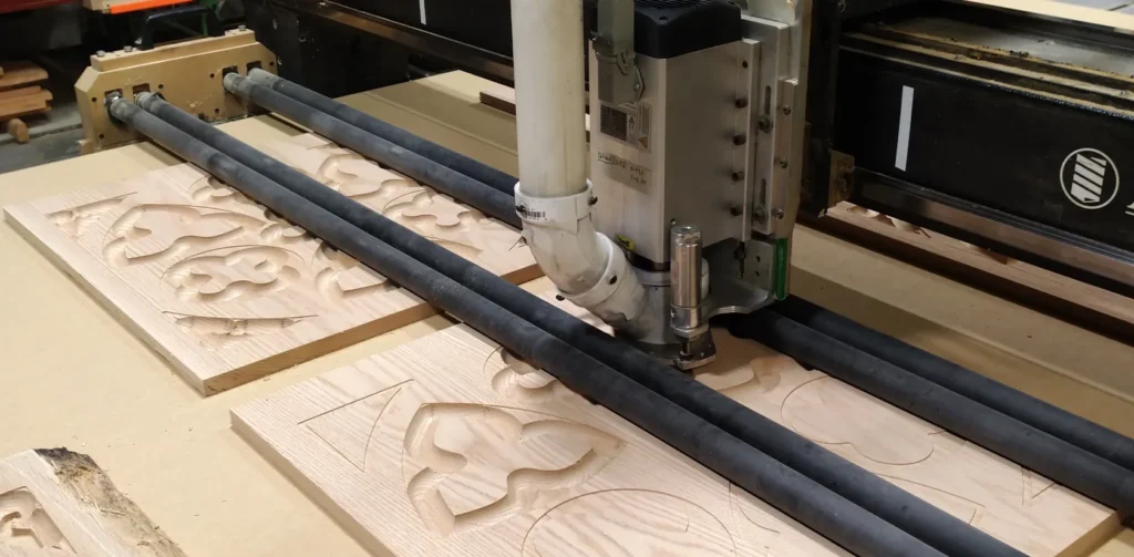 cnc router cutting gothic kneeler front from solid oak